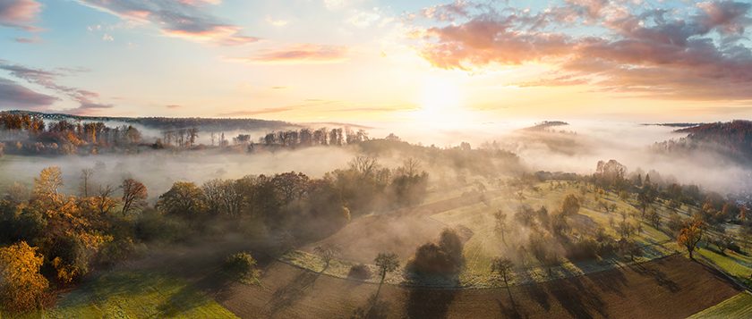 Stunning aerial panorama of a misty landscape